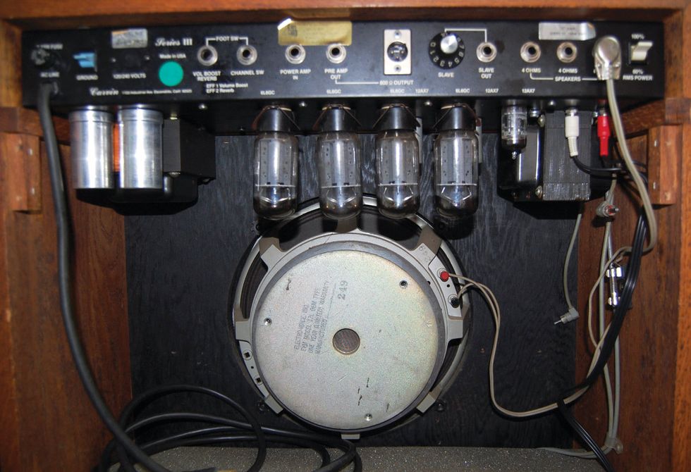 A rear view displays the EV 12L speaker and array of 6L6 power tubes and three 12AX7s. The reverb is solid-state, driven by a pair of discreet transistors.