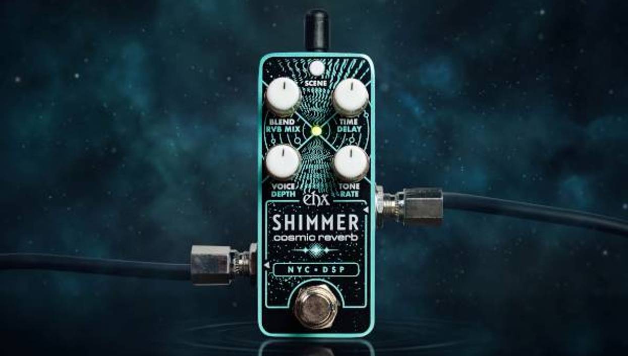 A cosmic reverb pedal with knobs for voice, blend, delay, and tone settings.