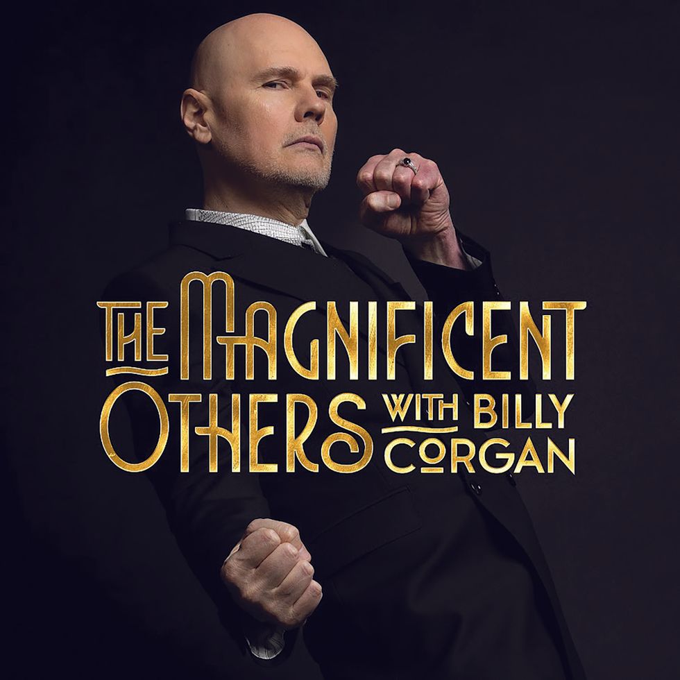 Billy Corgan poses confidently, dressed in black, with the title "The Magnificent Others" displayed.