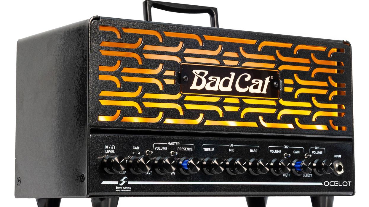 Black guitar amplifier with illuminated grill and various control knobs.