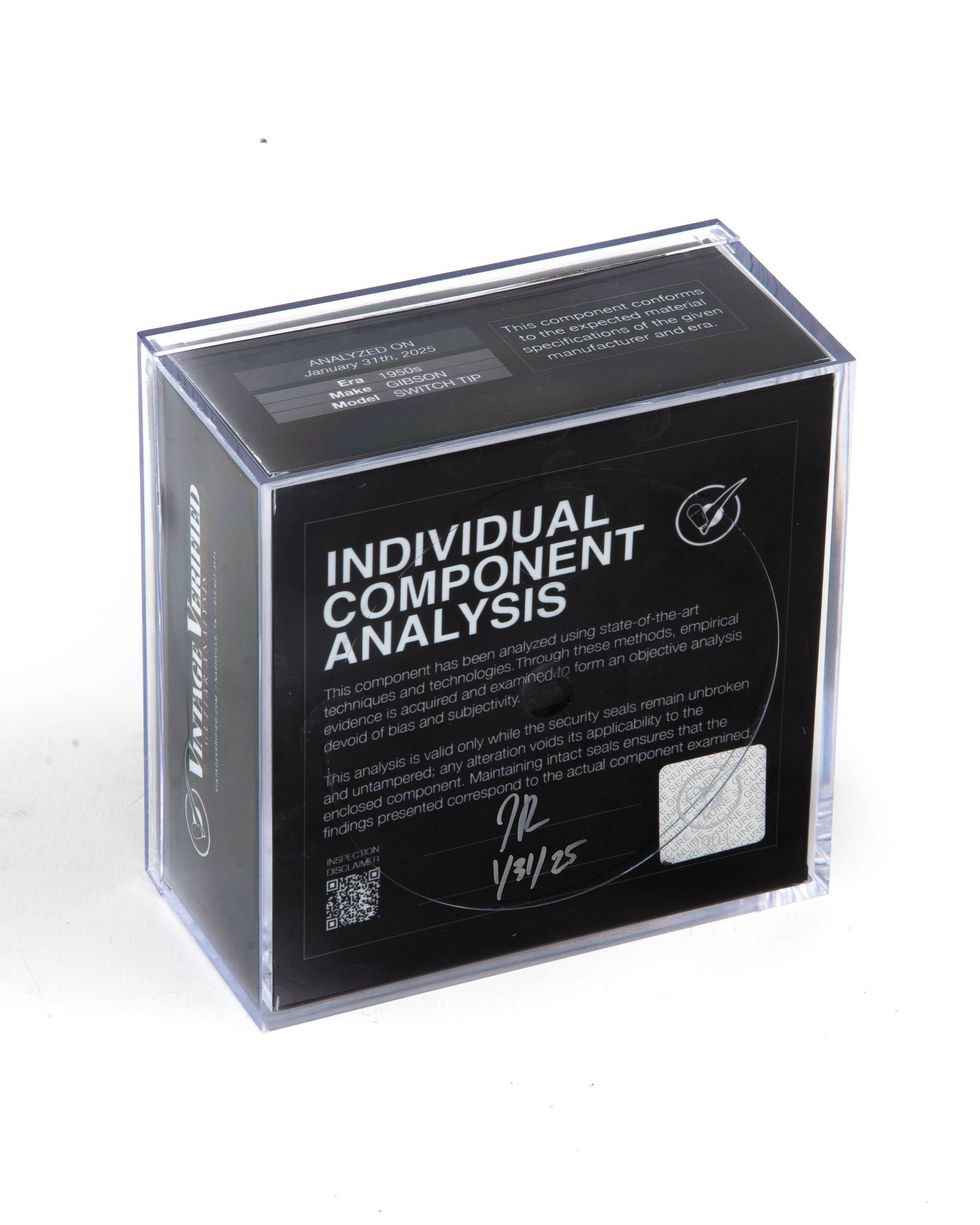 Clear display box containing an individual component analysis report with detailed specifications.