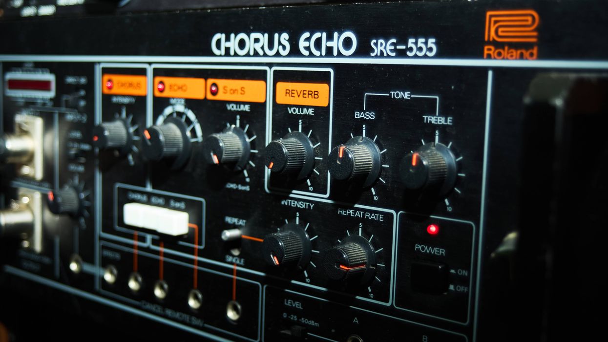 Close-up of a Roland SRE-555 Chorus Echo unit with various dials and settings.