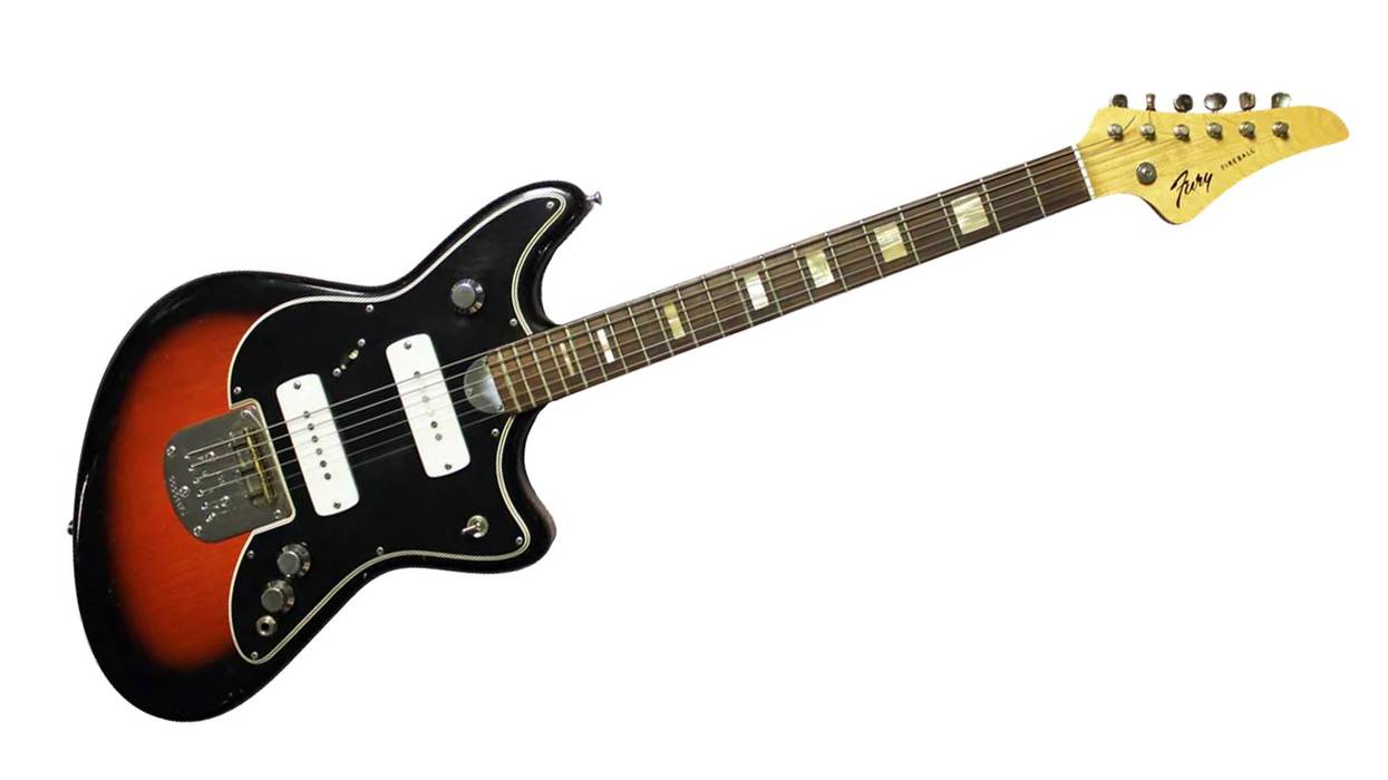 Electric guitar with a sunburst finish, black body, and distinctive shape.