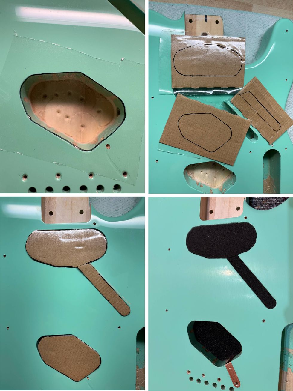Guitar body with cutouts and cardboard templates for electronic components placement.