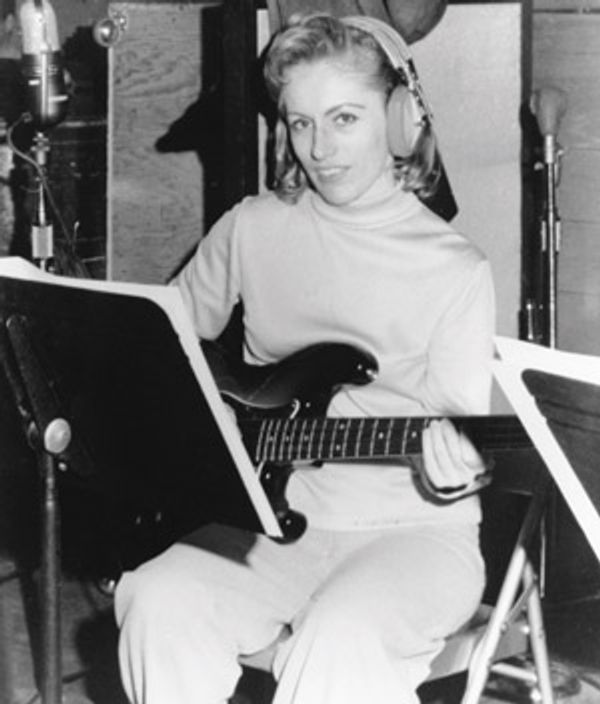 The focus and finesse of Carol Kaye during a recording session that shaped music history.