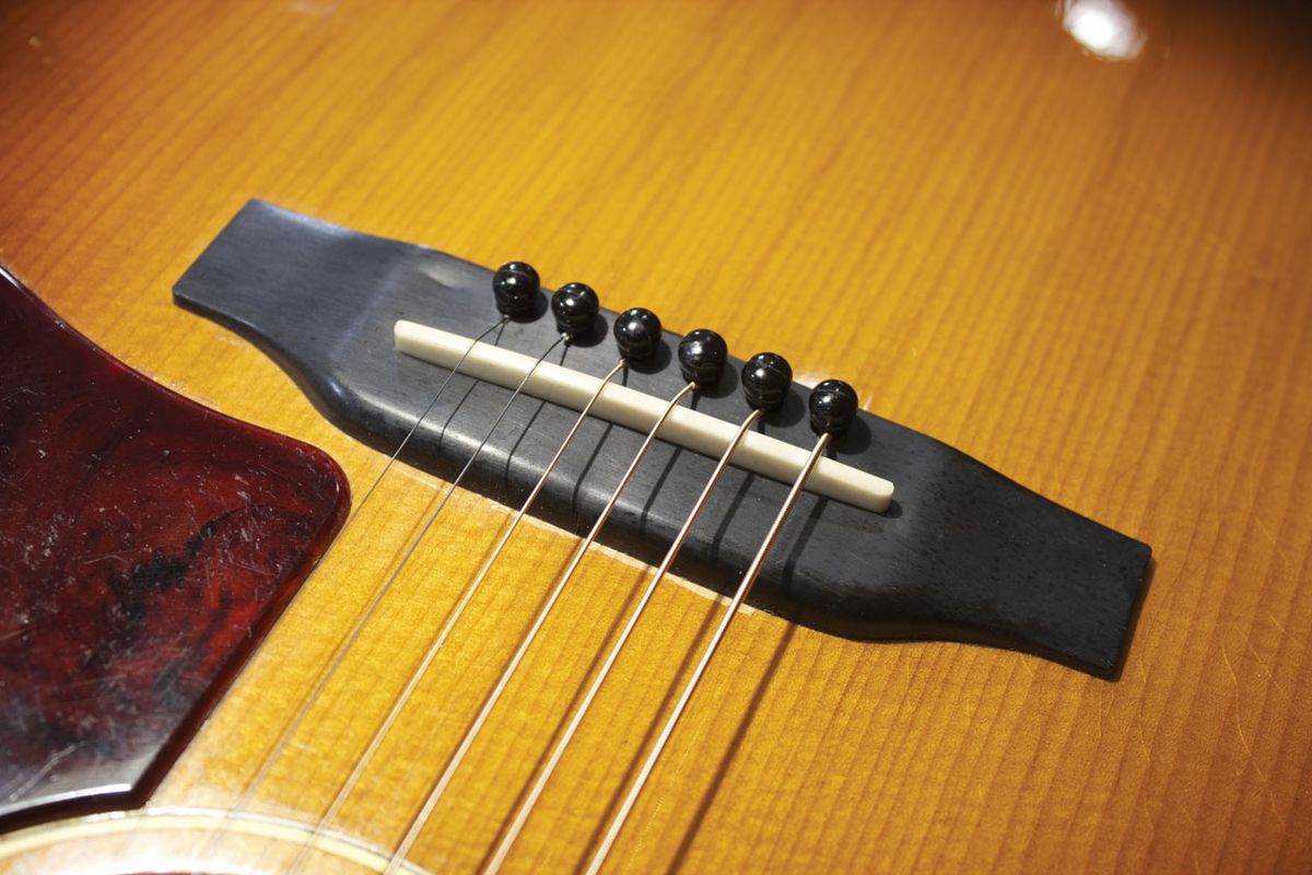 Why Plastic Bridges and Acoustic Guitars Don't Mix