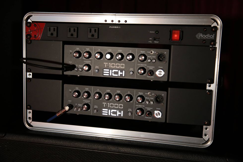 Rack-mounted audio equipment with power outlets and adjustment knobs for sound control.