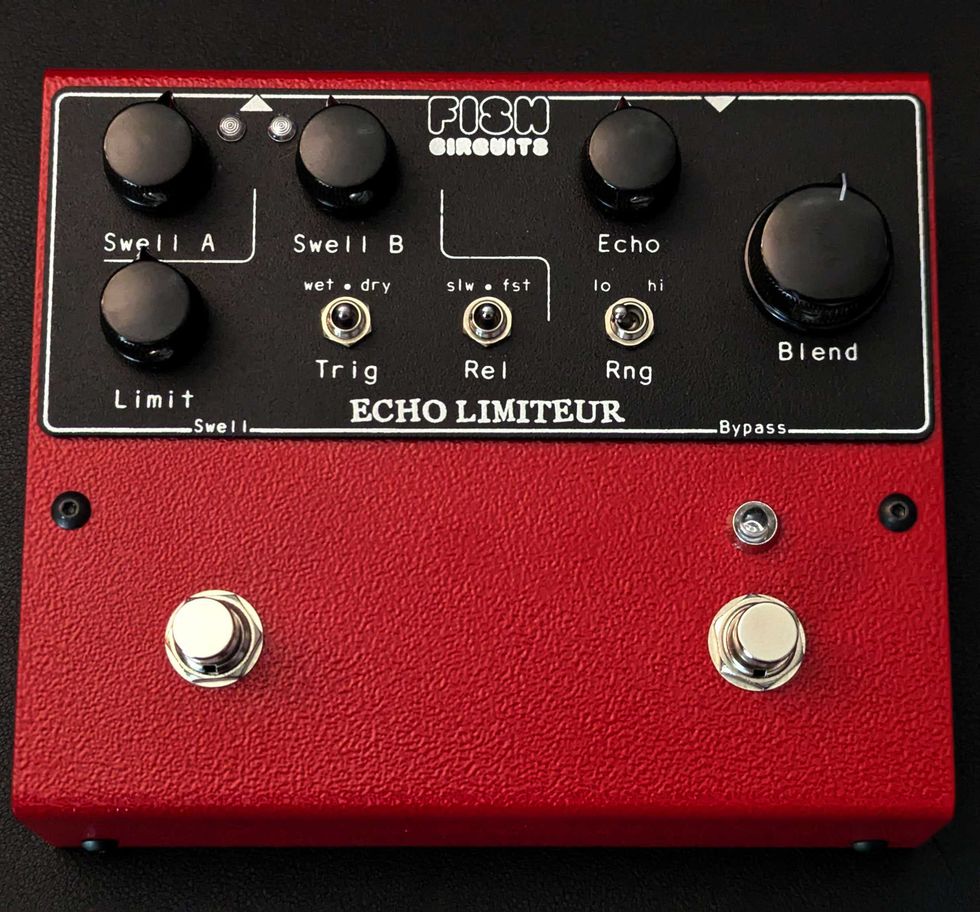 Red guitar effects pedal labeled "ECHO LIMITEUR" with various knobs and switches.