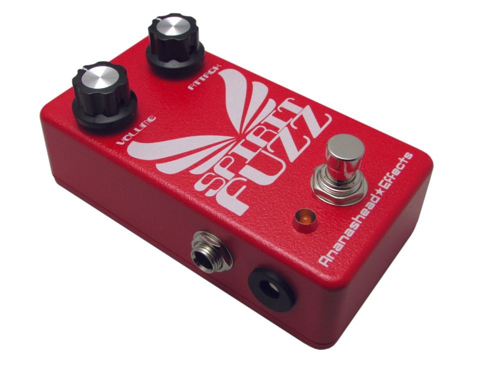 Red guitar effects pedal labeled "Spirit Fuzz" with volume and pitch knobs.