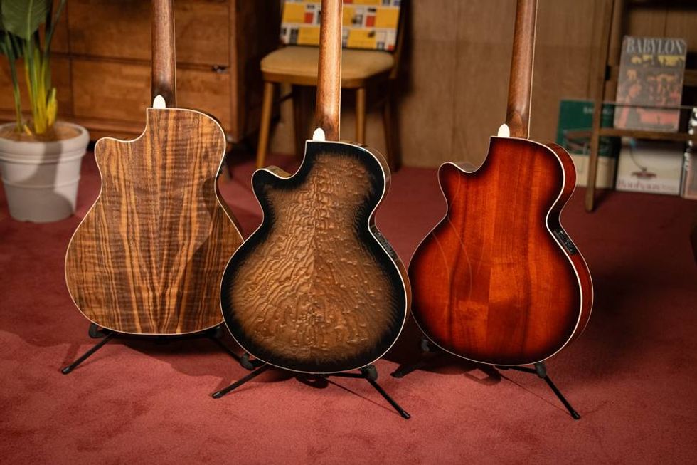 Three acoustic guitars displayed, showcasing unique back wood grain patterns.