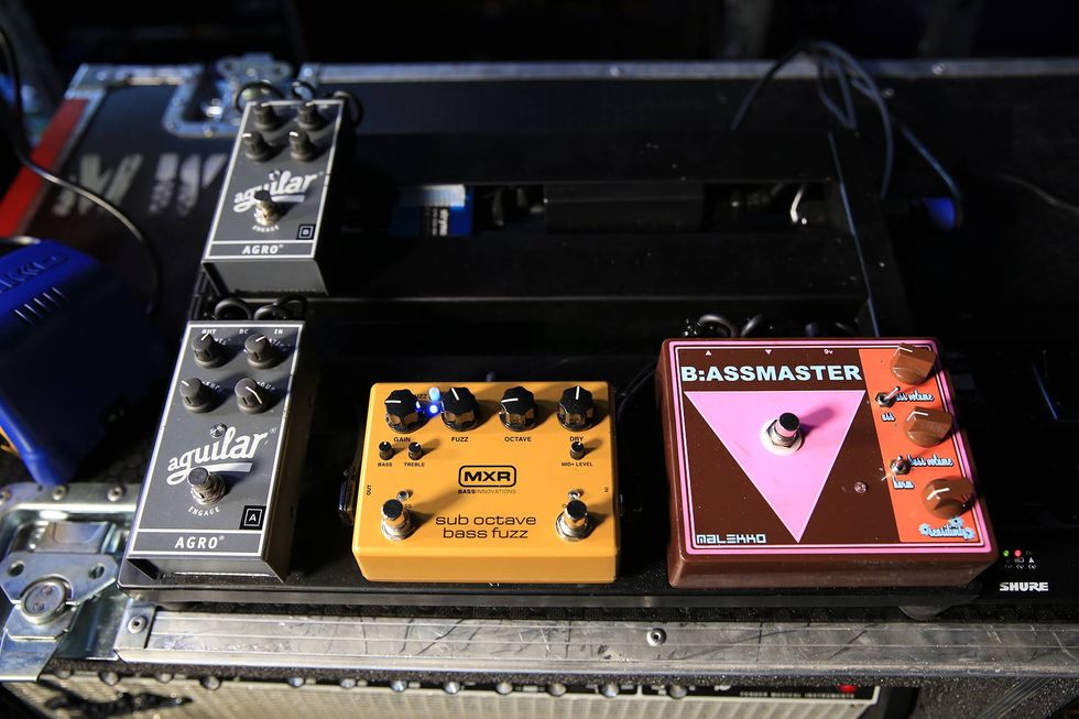 Three guitar pedals on a music setup: Aguilar Agro, MXR Sub Octave Bass Fuzz, and B:ASSMASTER.