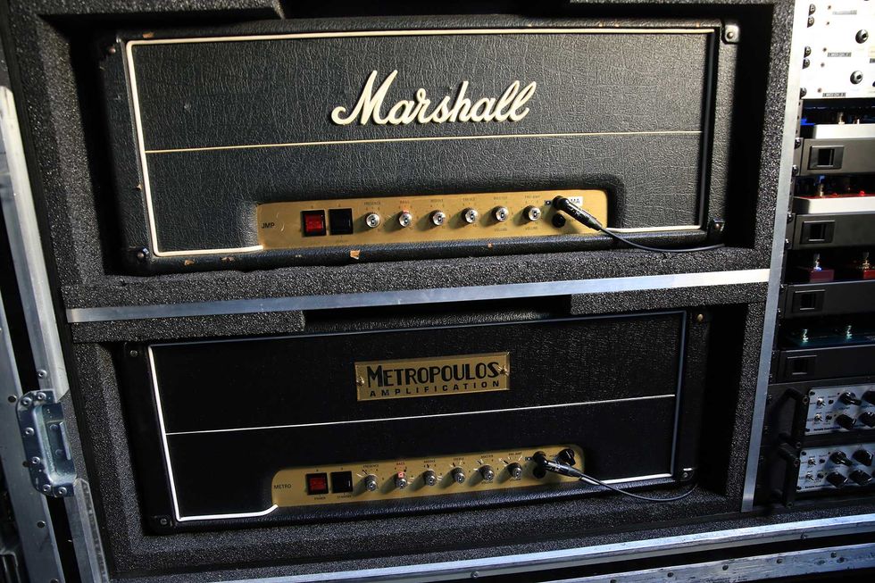Two guitar amplifiers stacked in a road case: Marshall on top, Metropoulos below.