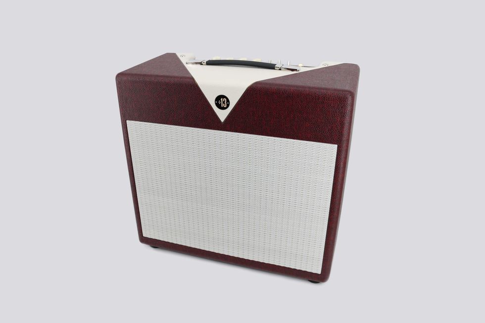 Vintage-style guitar amplifier in burgundy with a white speaker grill and black accents.