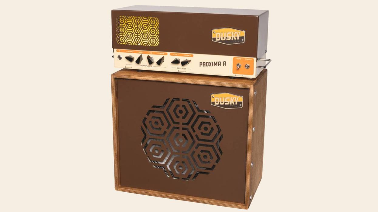 Vintage-style guitar amplifier with a geometric design and wooden cabinet.