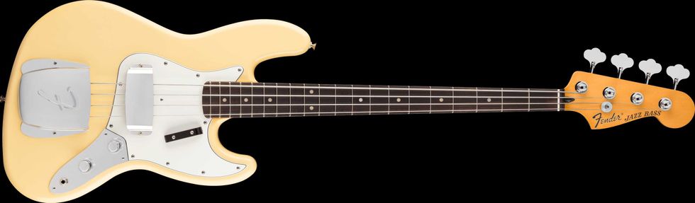 Yellow Fender Jazz Bass guitar with a sleek design and chrome hardware against a black background.